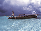 Bajau Fisherman in Traditional Lepa Boat with Rain Clouds Behind, Pulau Gaya, Borneo, Malaysia Posters by Jurgen Freund