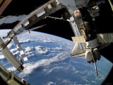 The Docked Space Shuttle Atlantis (STS-115) and a Soyuz Spacecraft Photographic Print by Stocktrek Images 