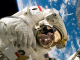An Astronaut Mission Specialist Participates in the Mission's Extravehicular Activity Photographic Print by Stocktrek Images 