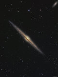 NGC 4565 is an Edge-On Barred Spiral Galaxy in the Constellation Coma Berenices Photographie par Stocktrek Images 