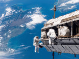 STS-116 Mission Specialists Participate in the First of the Three Mission's Extravehicular Activity Photographic Print by Stocktrek Images 