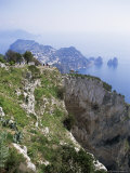 Distant Capri Village and Faraglioni Rocks, the Highest Point on the Island of Capri, Italy Photographic Print by Richard Ashworth Distant Capri Village and Faraglioni Rocks, the Highest Point on the Island of Capri, Italy Photographic Print by Richard Ashworth