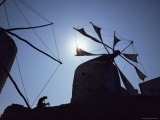 Woman and Goat Under Sail Driven Windmills, Olimbos, Karpathos, Greece Photographic Print by David Beatty