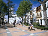 People Relaxing in Church Square in Front of the El Salvador Church Photographie par Pearl Bucknall