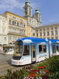 Tram and Old Cathedral, Hauptplatz, Linz, Austria Photographic Print by Charles Bowman