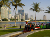 Train in the Park, and Sharjah Creek Skyline, Sharjah, United Arab Emirates, Middle East Photographic Print by Charles Bowman