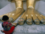 Woman Praying at the Feet of the Buddha in the Temple of the Standing Buddha Photographic Print by Bruno Barbier