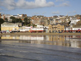 South Sands in South Bay at Low Tide with Seafront Buildings Reflected in Wet Sand on Beach Photographie par Pearl Bucknall