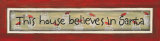 This House Believes in Santa Print by Karen Tribett