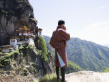 Bhutanese Man with Cell Phone, Taktshang Goemba (Tiger's Nest) Monastery, Paro, Bhutan Photographic Print by Angelo Cavalli