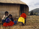 Small Group of Women and Girls of the Uros People on the Floating Reed Islands, Lake Titicaca, Peru Photographic Print by Mark Chivers