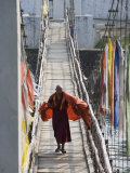 Buddhist Monk Crossing Bridge to Punakha Dzong, Punakha, Bhutan Photographic Print by Angelo Cavalli