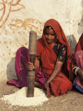 Woman Pounding Food in Village Near Deogarh, Rajasthan State, India Photographic Print by Robert Harding