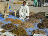 Man Selling Dates at the Market, Erfoud, Morocco, North Africa, Africa Photographic Print by Tony Gervis