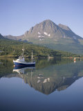 Boat and Mountains Reflected in Tranquil Water, Near Tromso, North Norway, Norway Photographic Print by David Lomax