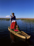 Uros Indian Woman and Traditional Reed Boat, Islas Flotantes, Lake Titicaca, Peru, South America Photographic Print by Gavin Hellier
