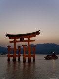 Vermillion Coloured 'Floating' Torii Gate Illuminated at Dusk, a Shinto Shrine Gate, Miyajima Photographic Print by Gavin Hellier