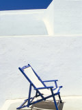 Deckchair Against Whitewashed Wall, Imerovigli, Santorini (Thira), Cyclades Islands, Greece Photographic Print by Lee Frost