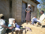 Woman Washing Clothes Outside Shack, Godet, Haiti, Island of Hispaniola Photographic Print by Lousie Murray