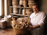 Baker with Selection of Bread, France Photographic Print by John Miller