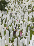 Muslim Woman and Child Tend a Grave at a War Cemetery, Sarajevo, Bosnia, Bosnia-Herzegovina Photographic Print by Graham Lawrence