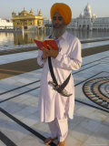 Sikh Pilgrim with Orange Turban, White Dress and Dagger, Reading Prayer Book, Amritsar Photographic Print by Eitan Simanor