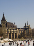 Skating on Ice Rink, with Vajdahunyad Castle in the Background, Hungary Photographic Print by Christian Kober