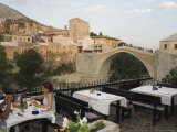 Restaurant Overlooking the Stari Most Peace Bridge on Neretva River, Bosnia, Bosnia-Herzegovina Photographic Print by Christian Kober