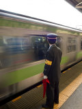 Platform Conductor, Subway Train at Rush Hour, Shinjuku, Tokyo, Honshu, Japan Photographic Print by Christian Kober