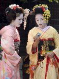 Geisha, Maiko (Trainee Geisha) in Gion, Kyoto City, Honshu, Japan Photographic Print by Christian Kober