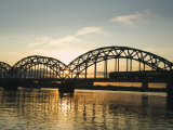 Sunset on the Daugava River and Steel Arches of Railway Bridge, Riga, Latvia, Baltic States Photographic Print by Christian Kober