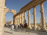 Tourist Camel Ride, Monumental Arch, Archaelogical Ruins, UNESCO World Heritage Site, Syria Photographic Print by Christian Kober