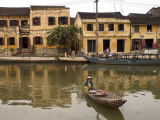 Boat on River in Front of Yellow Coloured Colonial Buildings, Hoi An, Vietnam, Southeast Asia Photographic Print by Christian Kober