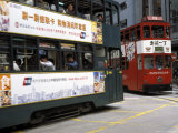 Two Double Decker Trams Passing at Sheung Wan, Hong Kong, China Photographic Print by Richard Nebesky