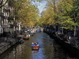 Small Boat on Tree-Lined Oudezijds Achtenburg Wal Canal in the Autumn, Amsterdam, the Netherlands Photographic Print by Richard Nebesky