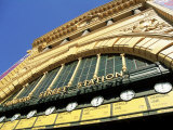 Facade of Front of Flinders Street Station with Clocks Showing Department of Next Train, Victoria Photographic Print by Richard Nebesky