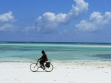 A Man Riding His Bicycle of Kiwengwa Beach, Island of Zanzibar, Tanzania, East Africa, Africa Fotografie-Druck von Yadid Levy