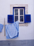 Laundry Hanging on Line at Window in the Moorish Quarter of Alfama, Lisbon, Portugal Photographic Print by Yadid Levy