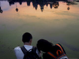 Watching the Sunrise Over Angkor Wat, Cambodia, Indochina, Southeast Asia Photographic Print by Andrew Mcconnell