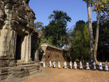 A Procession of Buddhist Nuns File Through the Temples of Angkor, Cambodia, Southeast Asia Photographic Print by Andrew Mcconnell