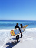 Two Surfers Walking with Their Boards on Kommetjie Beach, Cape Town, South Africa, Africa Photographie par Yadid Levy
