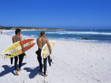 Two Surfers Walking with Their Boards on Kommetjie Beach, Cape Town, South Africa, Africa Photographie par Yadid Levy