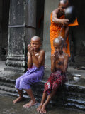 Young Buddhists Have Their Heads Shaved as an Offering to Buddha, Cambodia, Southeast Asia Photographic Print by Andrew Mcconnell