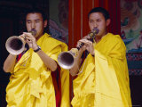 Monks Blowing Flutes Outside a Gompa (Tibetan Monastery), Bodhnath, Katmandu, Nepal Photographic Print by Marco Simoni