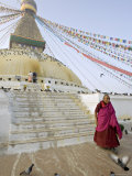 Buddhist Monk Descends the Steps of Boudha, the Tibetan Stupa in Kathmandu, Nepal Photographic Print by Don Smith