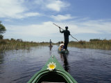 Tourists in Dug out Canoe (Mokoro), Okavango Delta, Botswana, Africa Photographic Print by Jane Sweeney