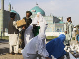 Family Feeding the Famous White Pigeons, Mazar-I-Sharif, Afghanistan Photographic Print by Jane Sweeney