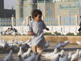 Child Chasing the Famous White Pigeons, Mazar-I-Sharif, Afghanistan Photographic Print by Jane Sweeney