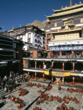 Monks Debate in Main Courtyard, Tashilhunpo Monastery, Shigatse (Xigatse), Tibet, China Photographic Print by Tony Waltham