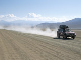 Land Cruiser on Altiplano Track and Tourists Going to Laguna Colorado, Southwest Highlands, Bolivia Photographic Print by Tony Waltham